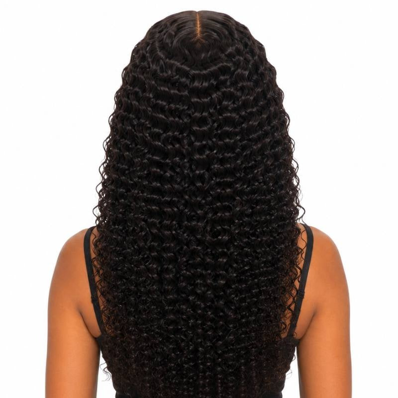 Back view of natural black kinky curly tape-in hair extensions on a model showing the dense curl pattern down the back