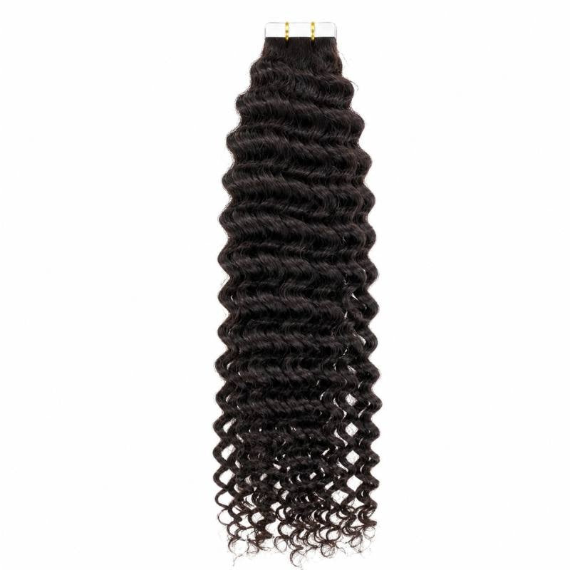 Natural black kinky curly tape-in hair extensions hanging full length from the tape tabs against a white backdrop
